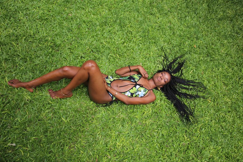 Girl in bikini on Lawn Nature in Summer
