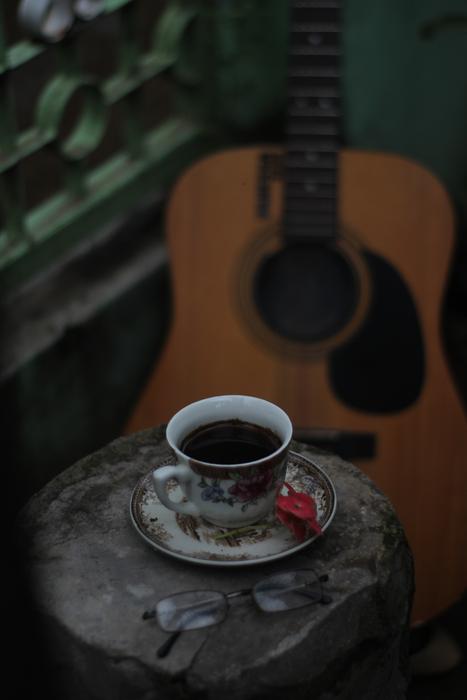 coffee with a guitar in the background