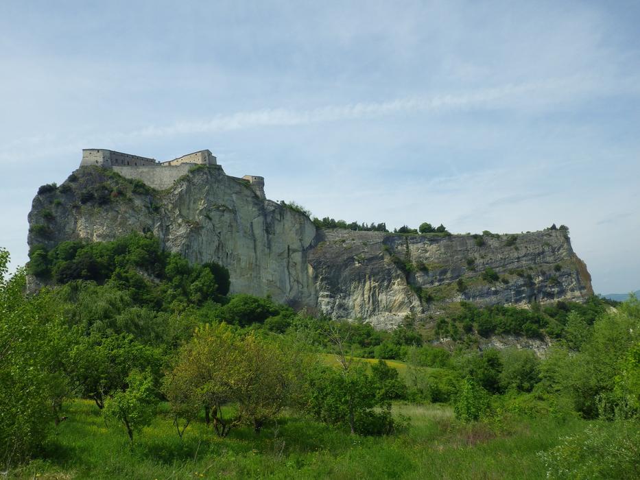 stone cliffs in green meadows