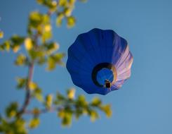 a blue ball in a blue sky