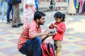 Child and man on street