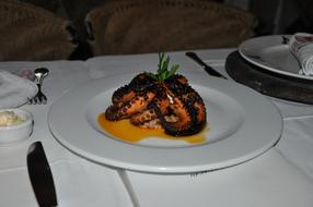 Fried octopus in cheese sauce