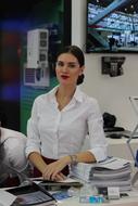 brunette in white blouse at the exhibition