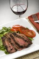 Roast meat with juicy tomatoes
