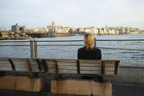 the blonde on the bench by the lake.