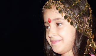 cute indian girl with jewelry on her head