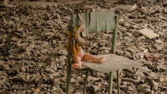 Doll Gas Mask on chair