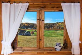 wooden window and white curtains in a country house