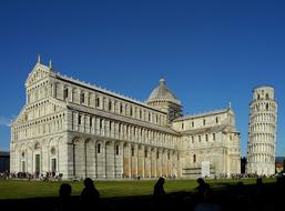 Leaning tower of pisa and historic building on blue sky background