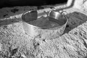 silver ring in the sand