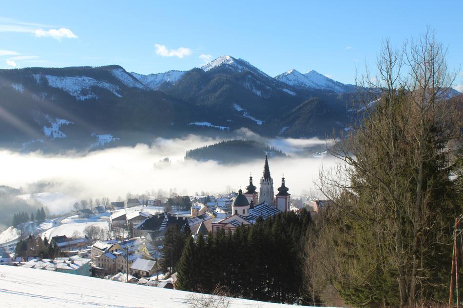 snowy landscape with a church in the distance