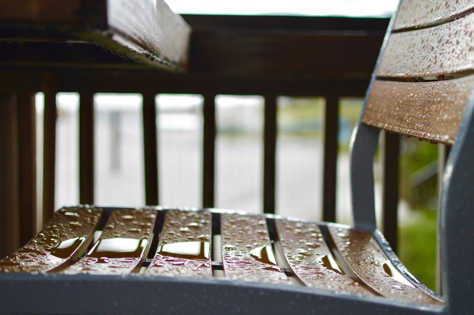 wooden bench in raindrops
