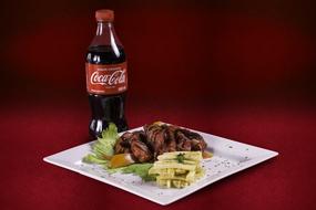Coca cola and a meat dish
