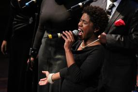 singer with a microphone sings from the heart