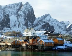 Fjord buildings by mountainside