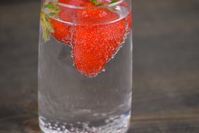 Close-up of the drink with the strawberries, in the glass