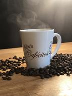 hot coffee with beans on the table