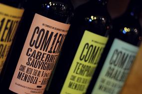 colored glass bottles of alcohol