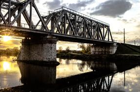 metallic industrial bridge over the river