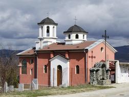 red house with white towers