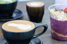 frothy coffee in a white mug