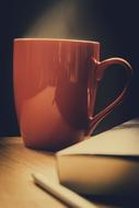 brown mug with hot coffee