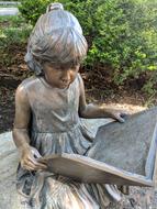 Reading girl Statue in Garden