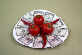 Fresh peppers and tomato on a plate