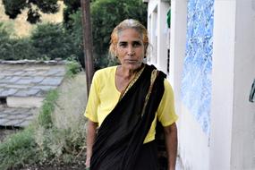 old woman in a yellow dress