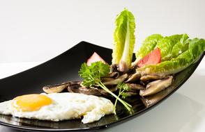 Scrambled eggs and salad on a plate