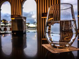 glass of water against the windows