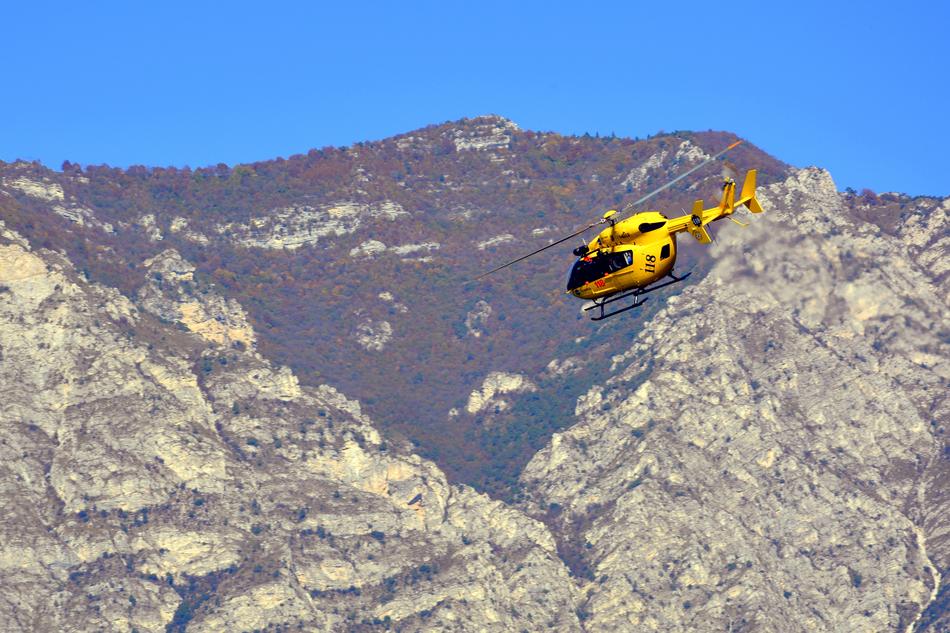 yellow helicopter in the mountains landscape