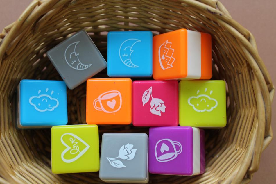Close-up of the colorful cubes with signs, in the wicker basket