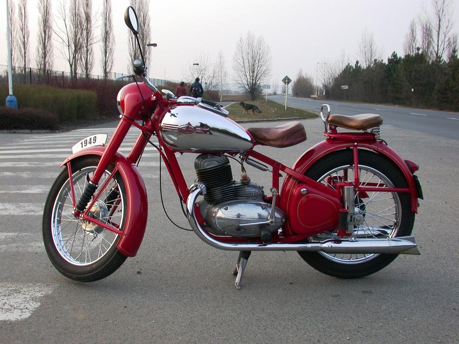 the red motorcycle is standing