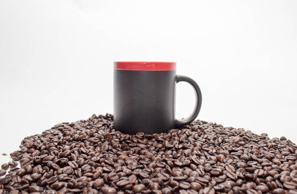 hot coffee beans with a cup