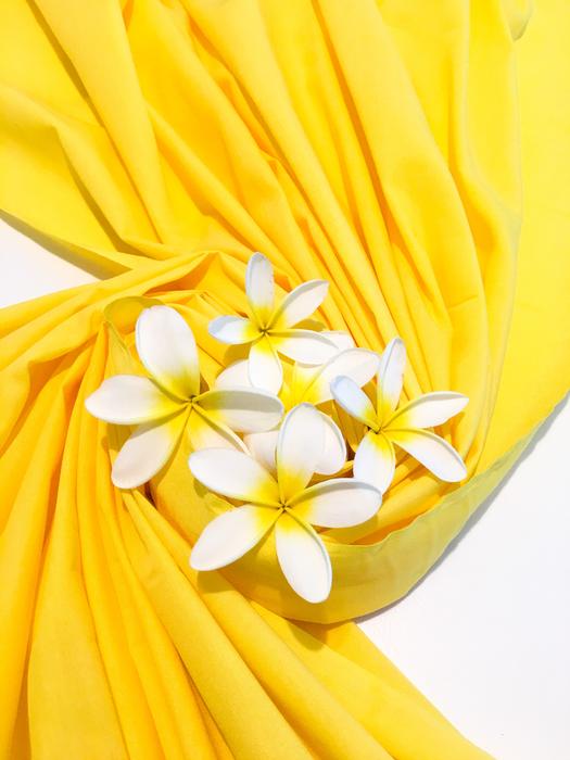 yellow curtain with white flowers