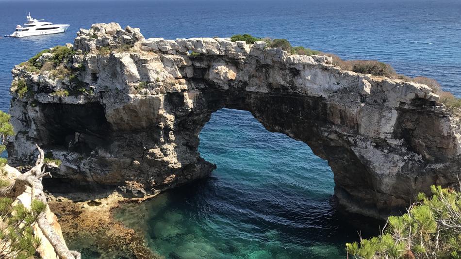 stone arch with blue water