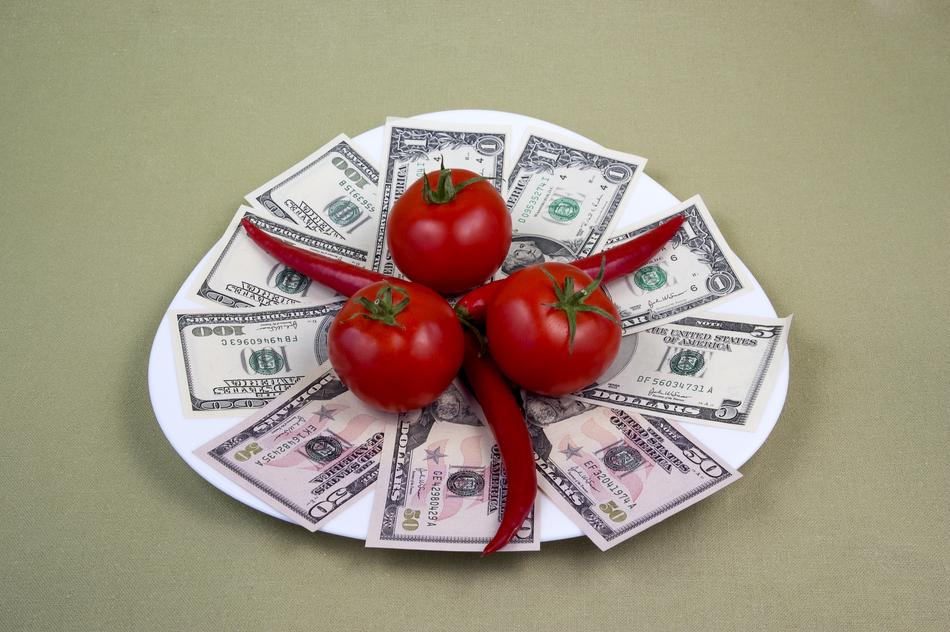 Fresh peppers and tomato on a plate