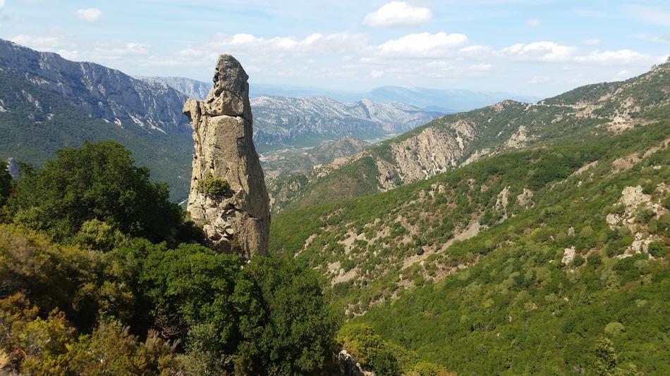 stone tower with green grass landscape