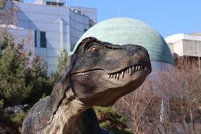 dinosaur sculpture in the park