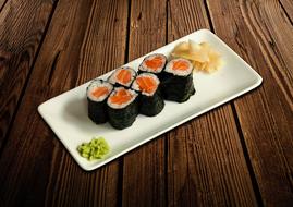 Fresh tasty rolls on a white plate