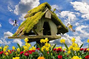 straw house with flowers