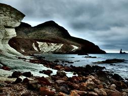 a house with stones and the sea