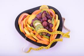 colored fruit in a bowl