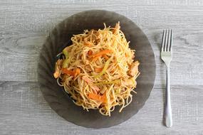 spaghetti with vegetables on a plate