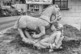 drunk man with horse, sculpture at house