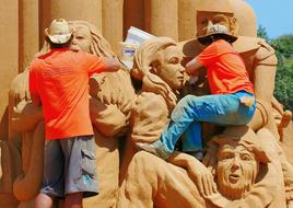 two men sculpting Sand people, australia, frankston