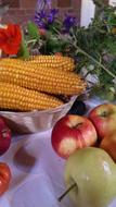 Corn and apple are delicious on the table