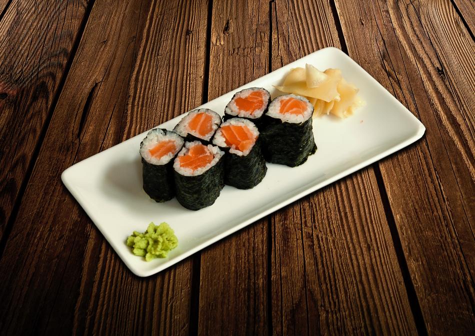 Fresh tasty rolls on a white plate