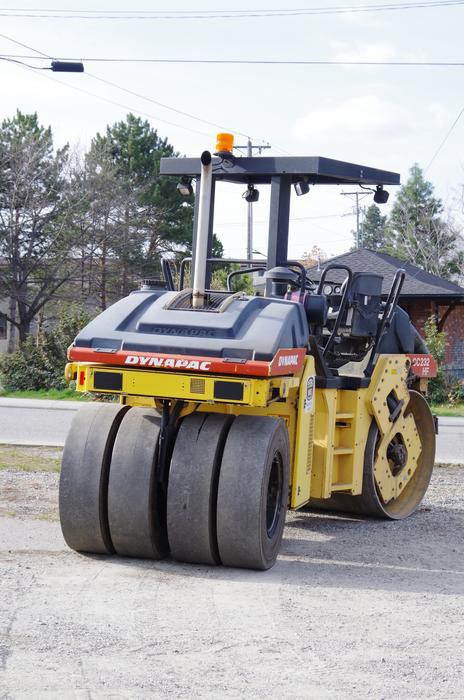 Colorful machine at the road construction outdoors